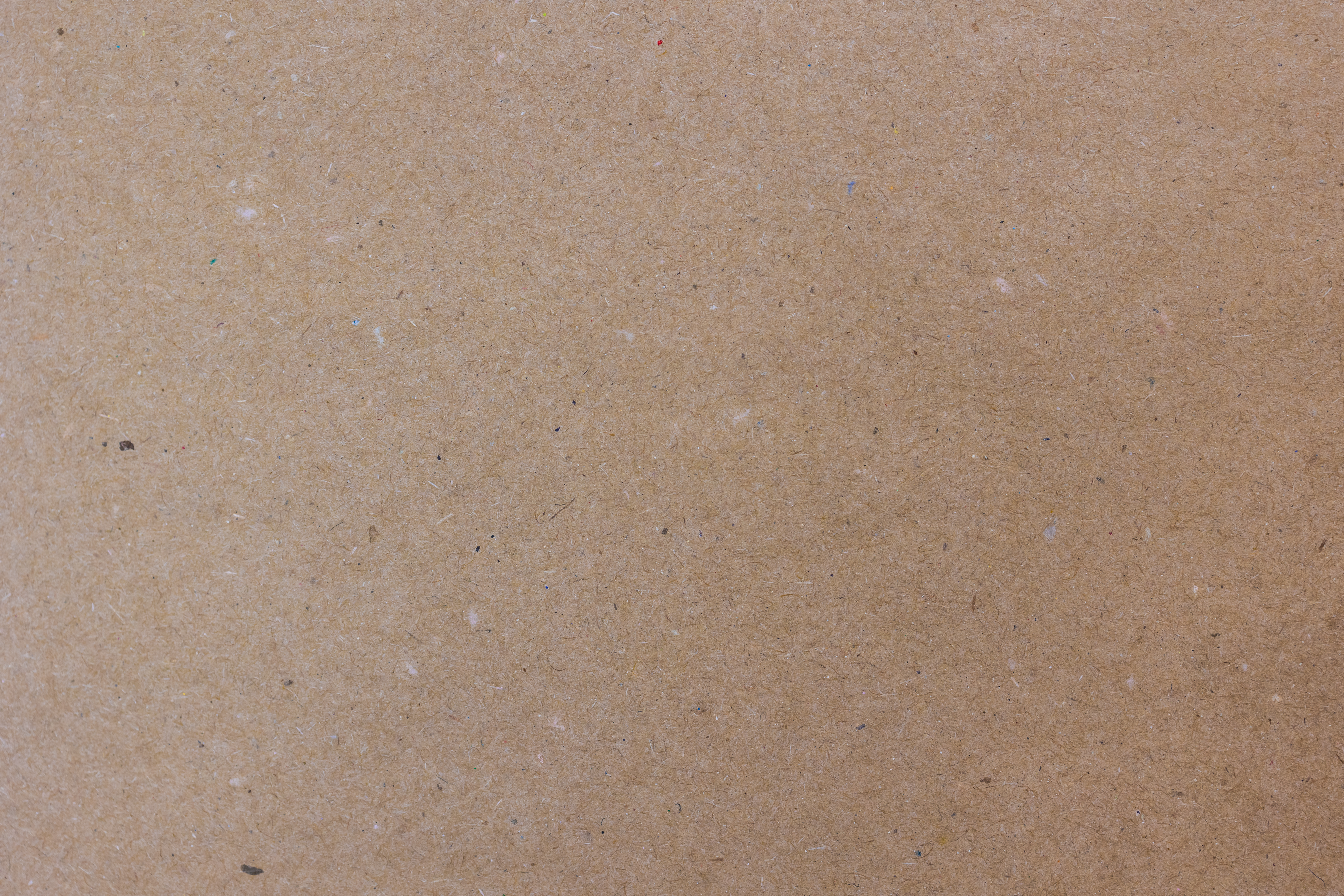 Textura macro de papel kraft natural reciclado para embalaje y manualidades.
